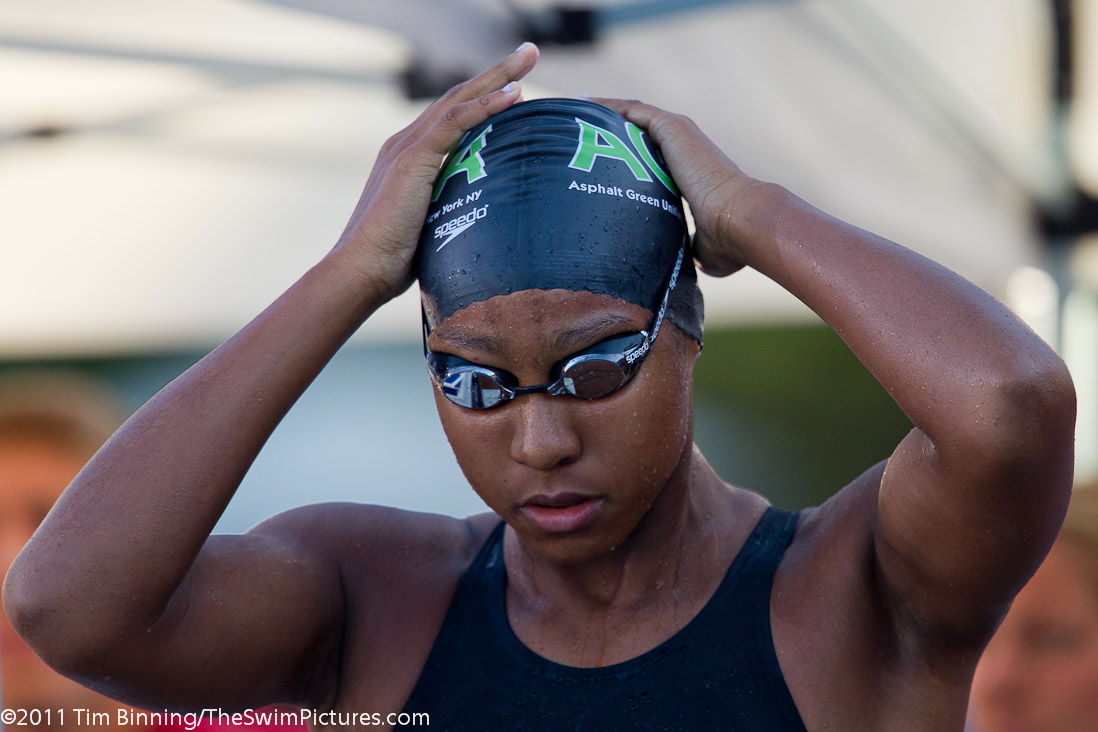 Lia Neal of Asphalt Green adjusts her cap prior to the start of the 50 free championship final at the 2011 ConocoPhillips USA Swimming National Championships.