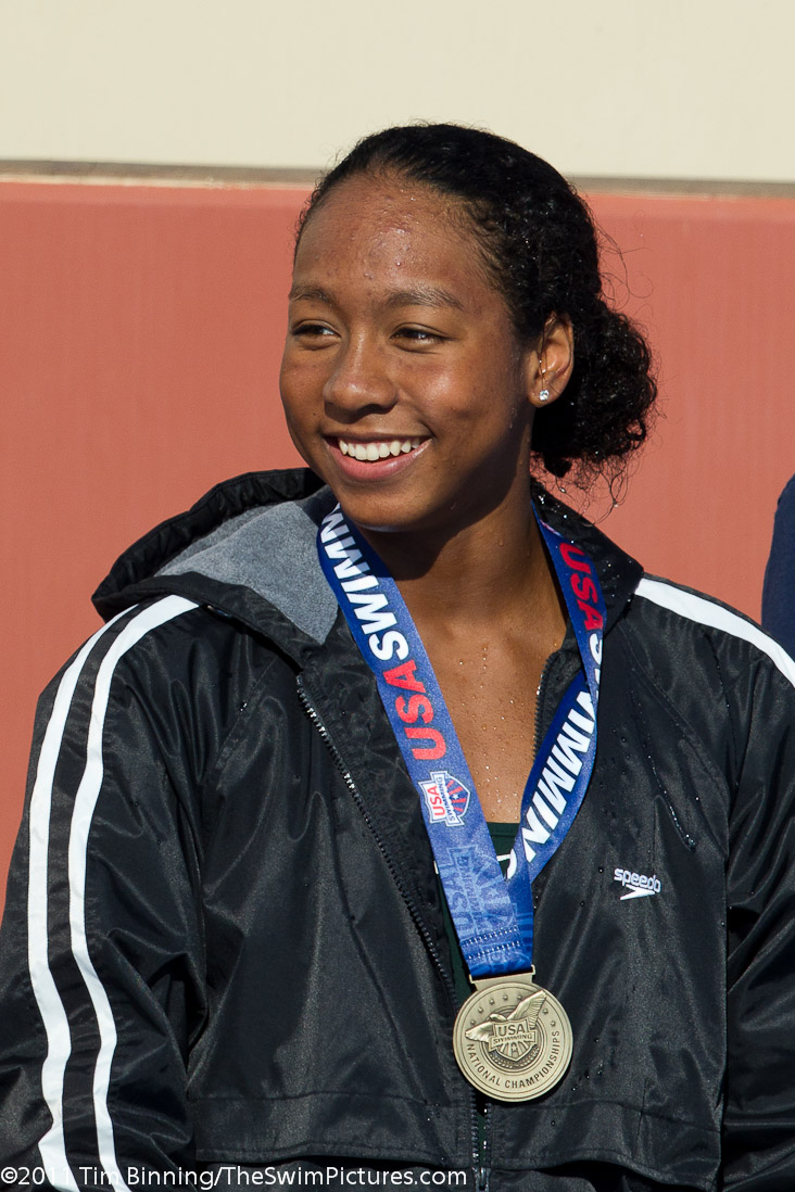 Lia Nea, 16, of Asphalt Green accepts a medal as 18 & under national champion at the 2011 ConocoPhillips USA Swimming National Championships.