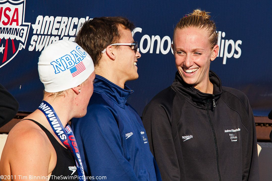 Dana Vollmer who is working with the Make a Wish Foundation is joined on the 100 free medal stand by her guest Andrew O'Dorisio of Tiburon, California.   O'Dorisio hopes to attend the 2012 London Olympics.