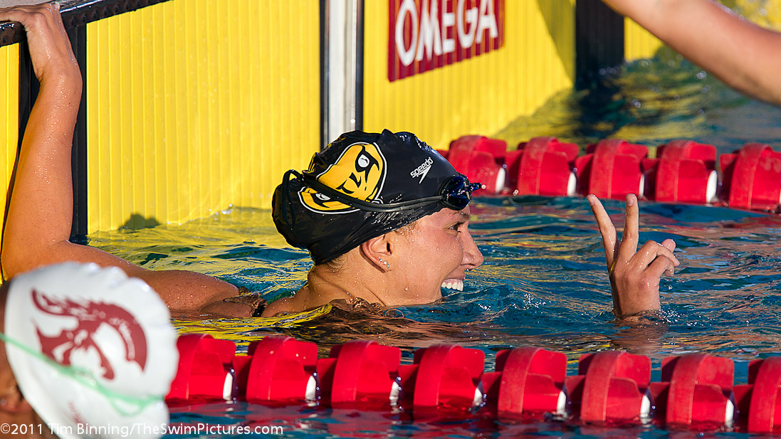 Meghan Hawthorne of Rattler Swim Club and USC flashes the victory sign after winning the 200 breast C final (2:31.26) at the 2011 ConocoPhillips USA Swimming National Championships.