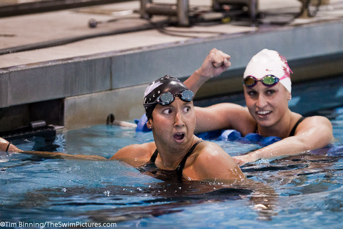 Anne-marie Botek (left of T2) and Samantha Woodward of Stanford Aquatics (right) following the 100 butterfly B final.