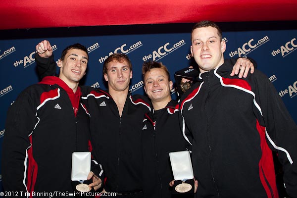 The NC State team of Ivan Kopas, Ian Bishop, Barrett Miesfeld and Jonathan Boffa on the victory stand following their win in the 400 medley relay win on the third night of competition at the 2012 ACC Men's Swimming and Diving Championships.