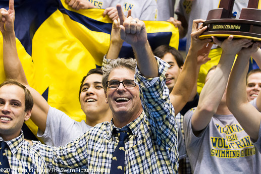 Coach Mike Bottom and the University of Michigan team celebrate their victory in the 2013 NCAA Division 1 Swimming and Diving Championships