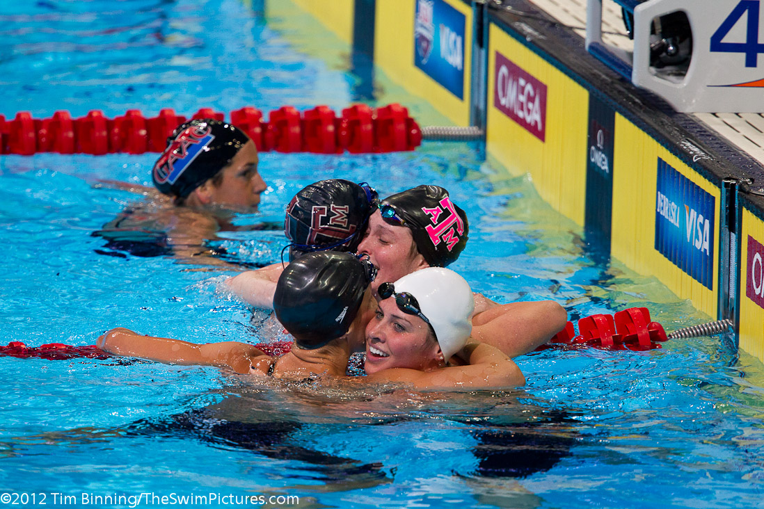Camille Adams of Texas A&M and Kathleen Hersey of Longhorn Aquatics are congratulated after their 1-2 finish in the 200 fly. | 20, 22, Adams, Aggie Swim Club, Cammille Adams, GU, Hersey, Kathleen Hersey, Longhorn Aquatic, ST, _Adams_Cammille, _Hersey_Kathleen