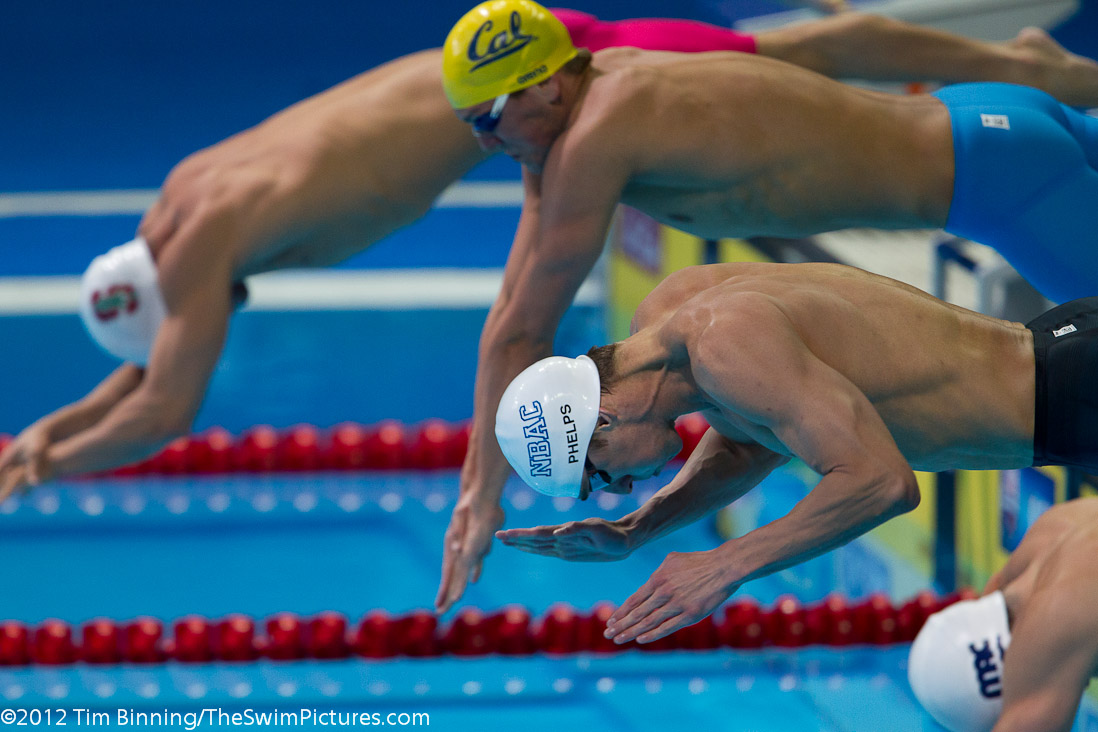 Michael Phelps starts the 100 fly semi-final.