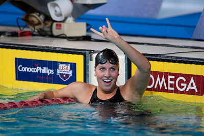 Kathleen Hersey flashes the University of Texas hookem horns after taking the 200 butterfly and a US Team World Championship spot at the 2009 ConocoPhillips USA National Swimming Championships and World Championship Trials
