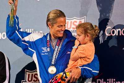 Dara Torres on the victory stand with her daughter following her win in the 50 free at the 2009 ConocoPhillips USA National Swimming Championships and World Championship Trials